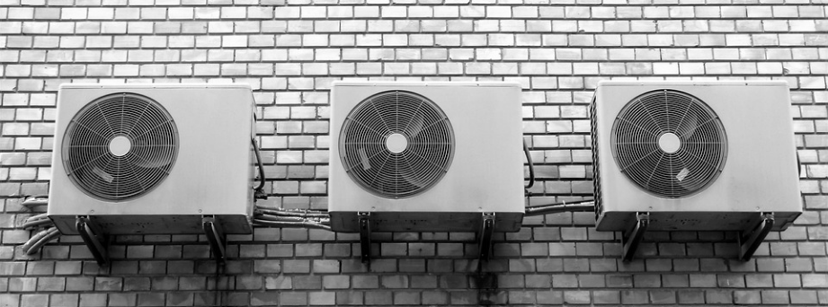 three air conditioner fans installed on the wall